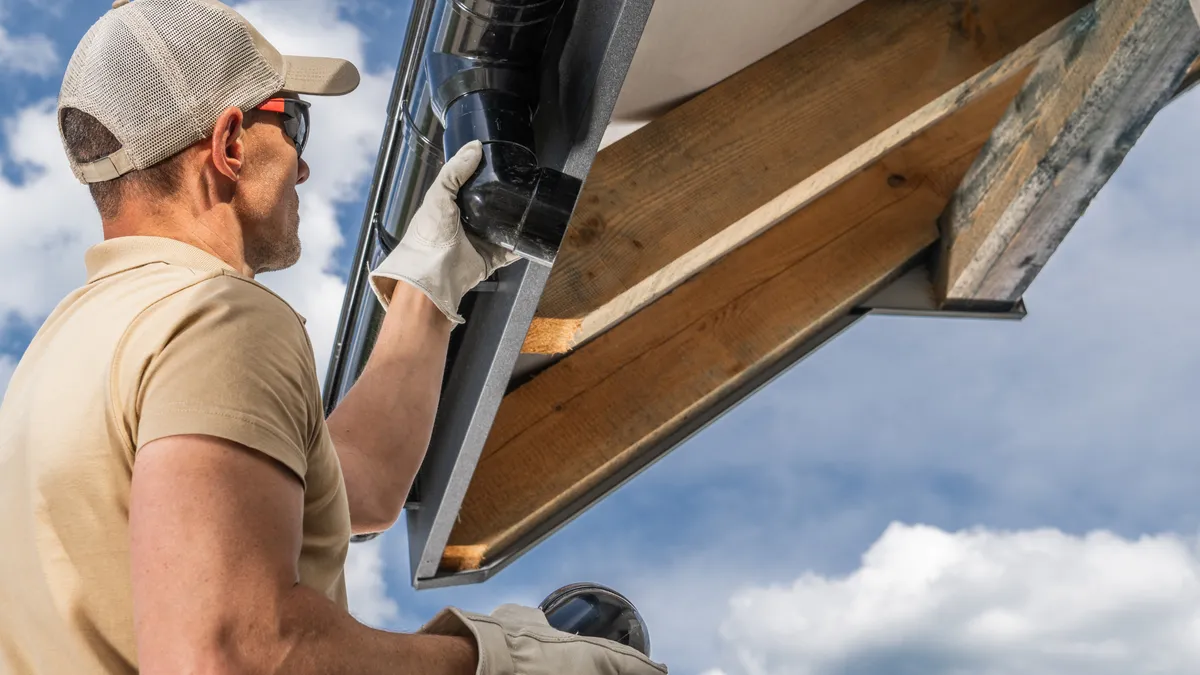 Professional gutter installation on a Carmel, Indiana home